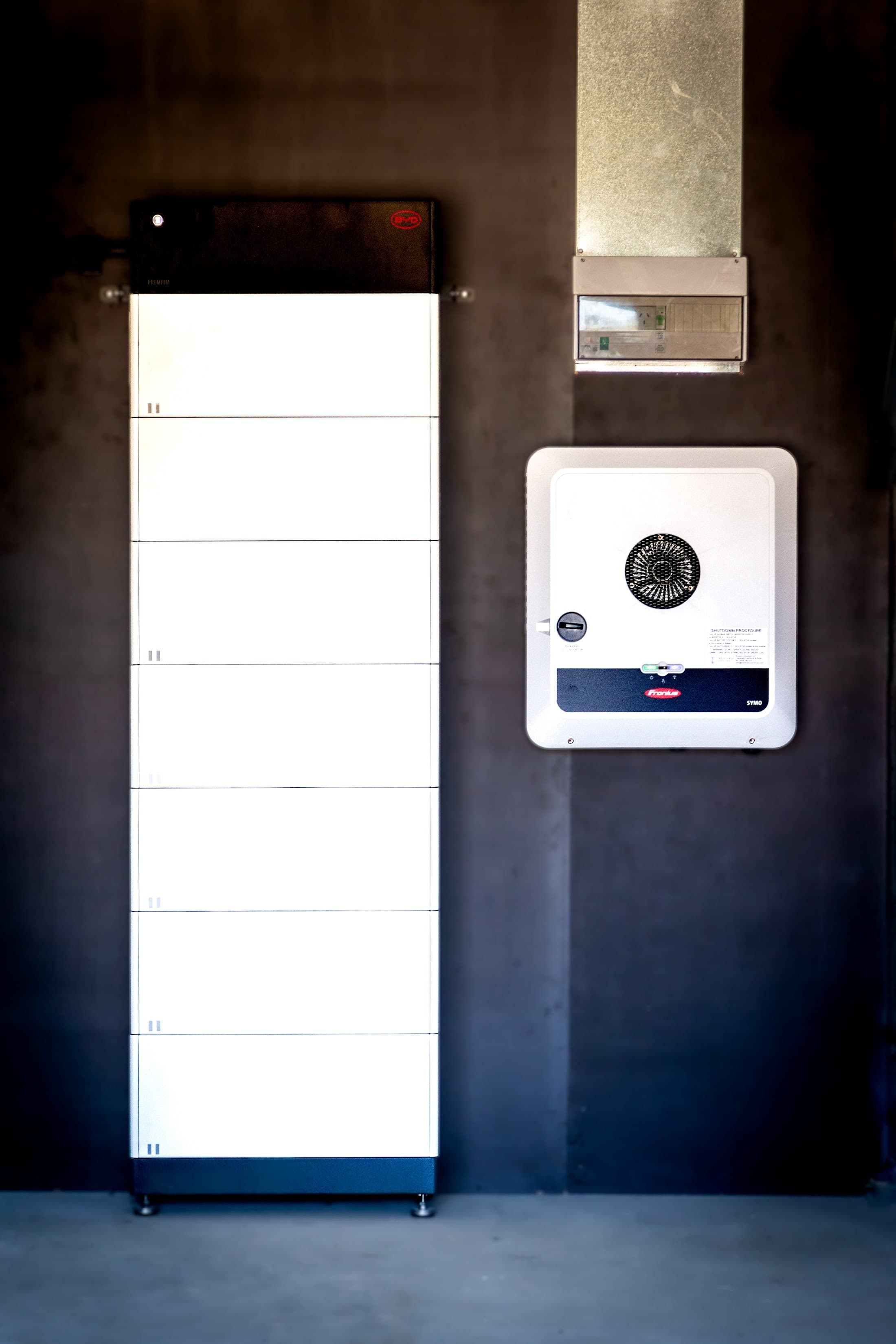 A Fronius inverter beside a BYD Battery-Box tower at the Cornish St install