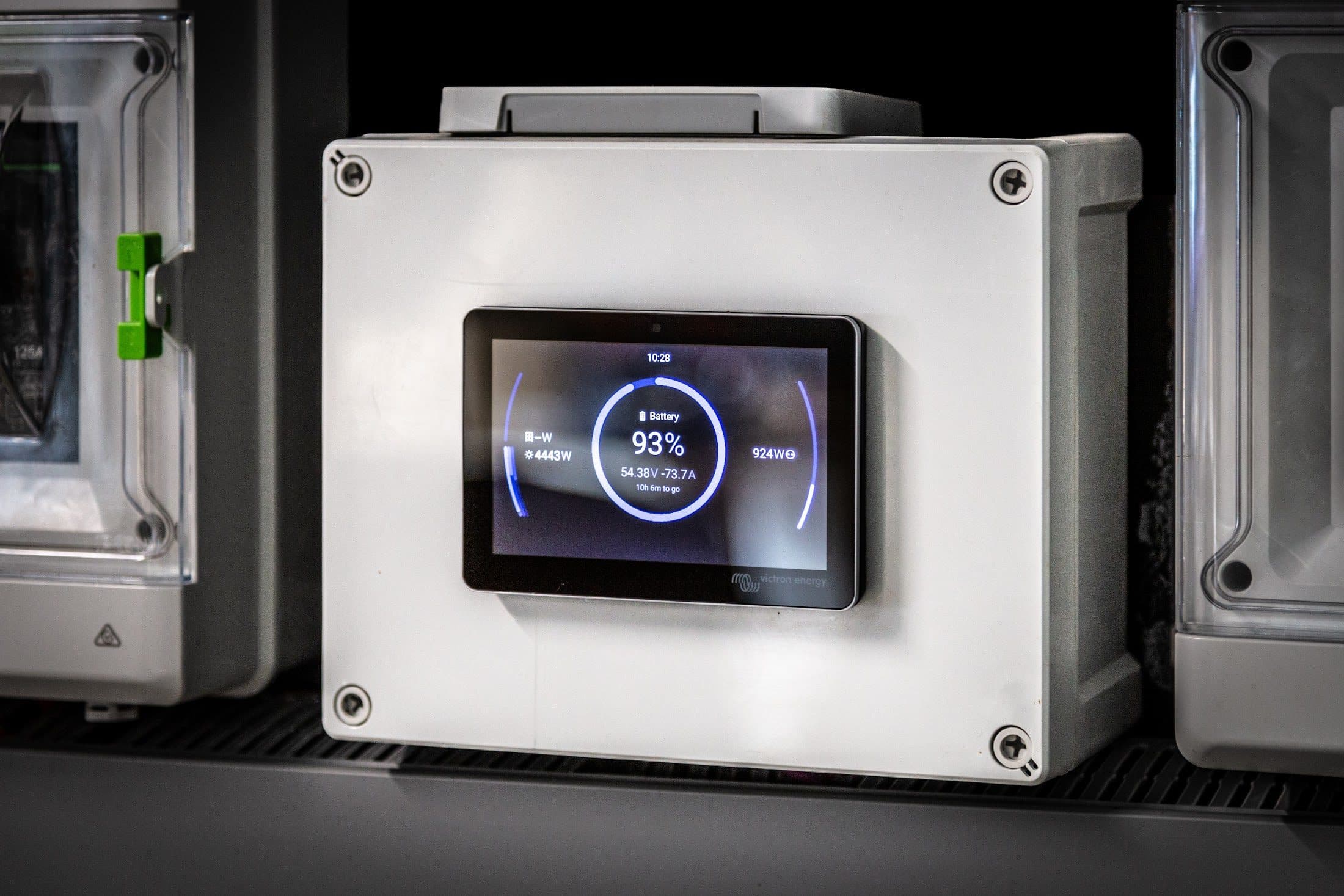 A Victron touchscreen showing the battery at 93% on the off grid board at 99 Falloons